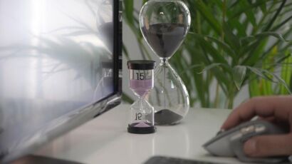 clear hour glass on white table