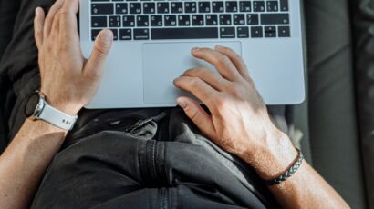 Free A Person Working on His Laptop Stock Photo