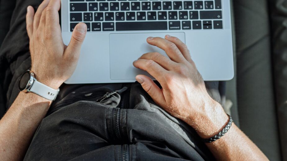 Free A Person Working on His Laptop Stock Photo