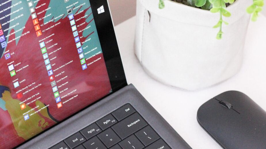 black laptop computer beside black wireless mouse