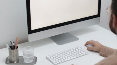 Free Crop man working on computer in workplace Stock Photo
