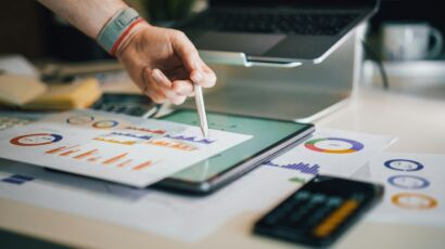 a person is writing on a piece of paper