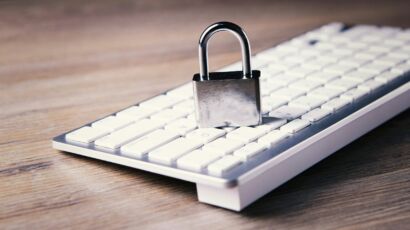 a computer keyboard with a padlock on top of it
