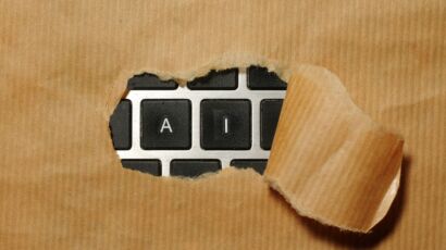 A piece of cardboard with a keyboard appearing through it