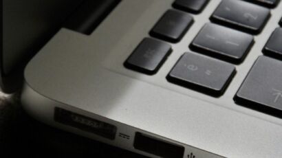 Free Detailed view of a silver laptop showing keyboard and multiple ports. Stock Photo